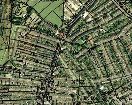 Historic OS mapping overlaid on a modern aerial photograph, showing earlier field boundaries reflected in many later street patterns